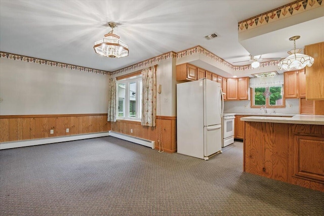 20 Cleveland Ave, East Bangor, PA 18013 - kitchen with white appliances, carpet flooring, a wainscoted wall, baseboard heating, and light countertops