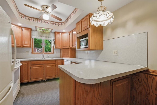 20 Cleveland Ave, East Bangor, PA 18013 - kitchen with a sink, white appliances, a peninsula, and light countertops