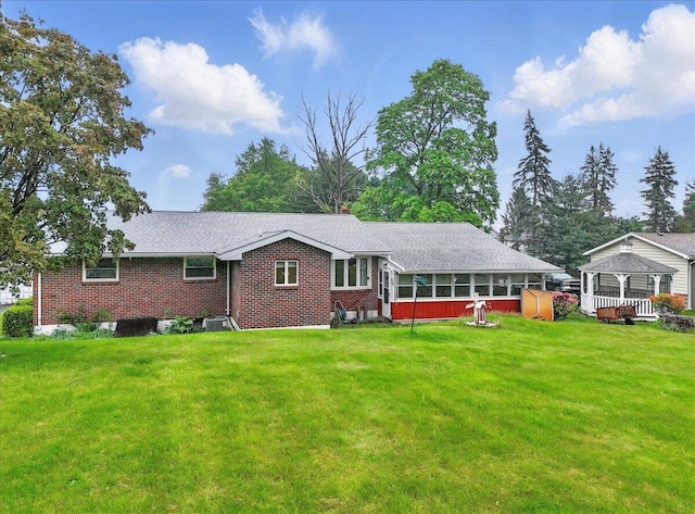 20 Cleveland Ave, East Bangor, PA 18013 - rear view of property with a gazebo, a yard, and brick siding