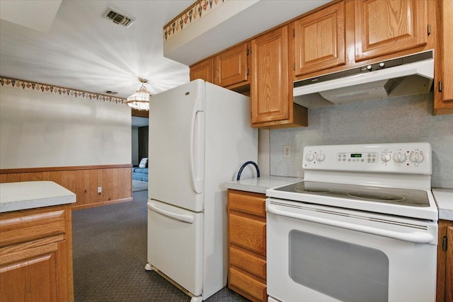 20 Cleveland Ave, East Bangor, PA 18013 - kitchen with white appliances, under cabinet range hood, light countertops, carpet, and a wainscoted wall