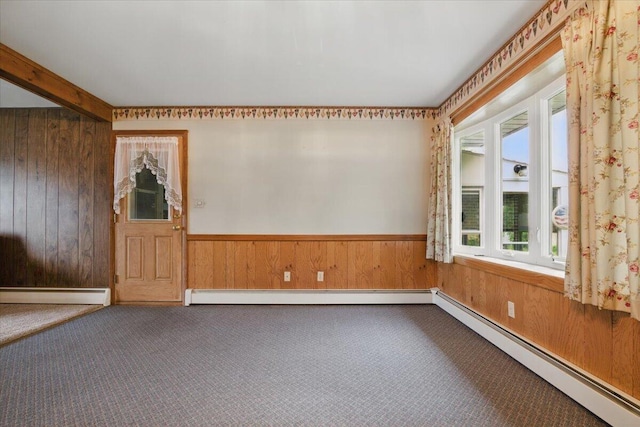20 Cleveland Ave, East Bangor, PA 18013 - carpeted spare room with baseboard heating, wooden walls, a wainscoted wall, and a baseboard heating unit