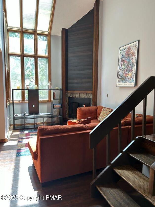 living area with wood finished floors and a fireplace