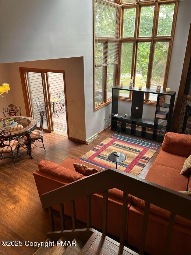 living room with wood finished floors and baseboards