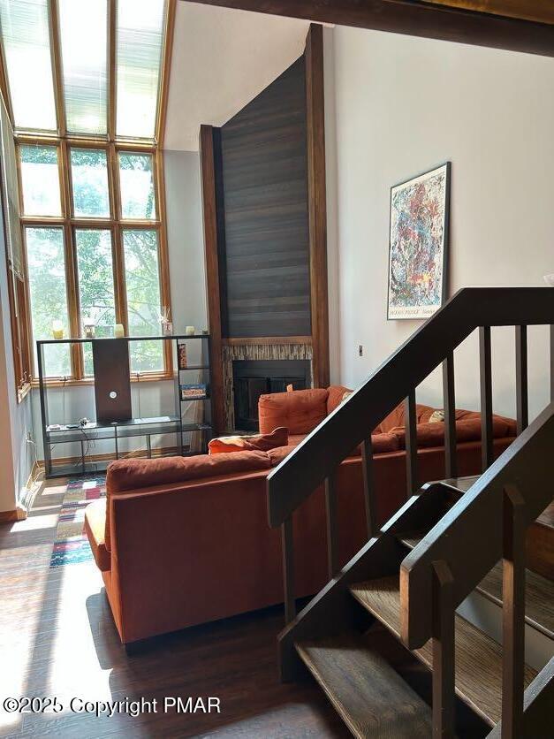 living room with a fireplace and wood finished floors