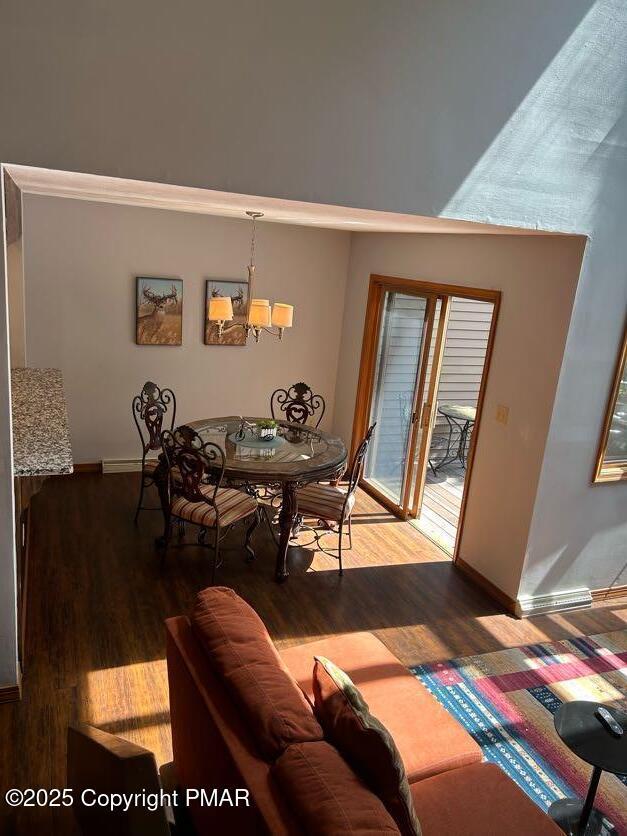 dining area with hardwood / wood-style flooring