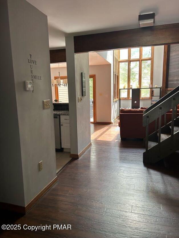 living room featuring baseboards and wood finished floors