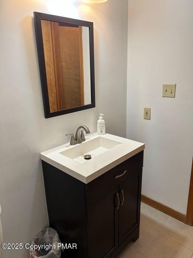 bathroom with vanity and tile patterned floors