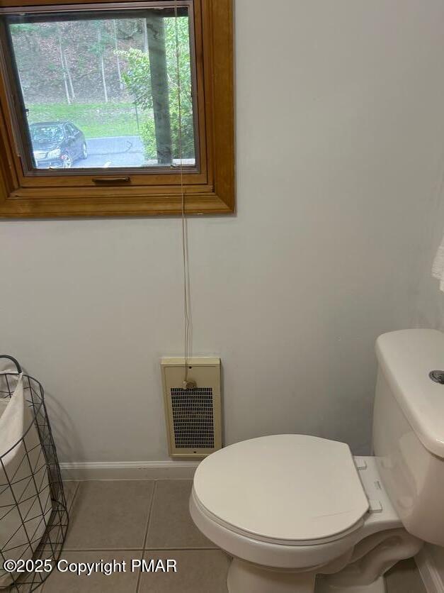 bathroom featuring tile patterned floors and toilet