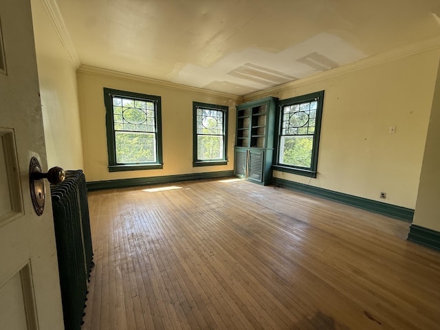 712 Thomas St, Stroudsburg, PA 18360 - spare room with hardwood / wood-style floors, plenty of natural light, crown molding, and baseboards