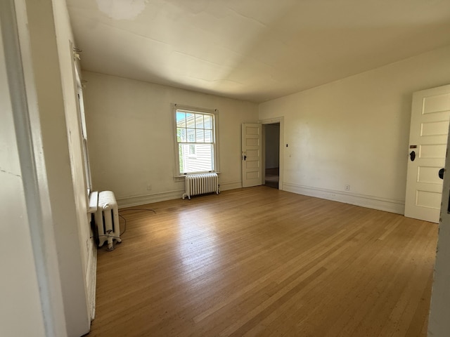 712 Thomas St, Stroudsburg, PA 18360 - unfurnished room featuring radiator, light wood finished floors, and baseboards