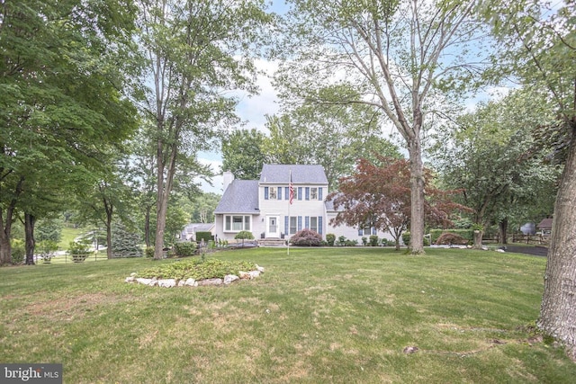 16 Kiloran Wynd Rd, Glenmoore, PA 19343 - view of front of house with a front lawn and a chimney