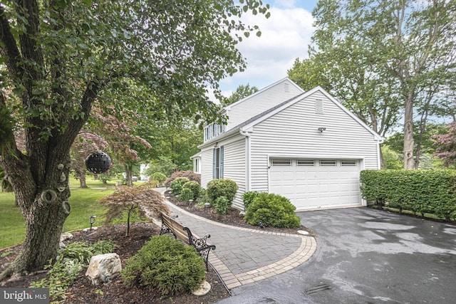 16 Kiloran Wynd Rd, Glenmoore, PA 19343 - view of side of home with driveway and an attached garage