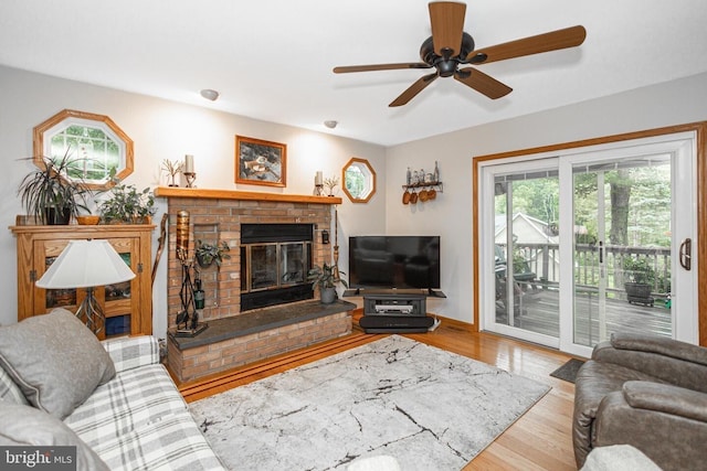 16 Kiloran Wynd Rd, Glenmoore, PA 19343 - living room featuring a fireplace, wood finished floors, and a ceiling fan