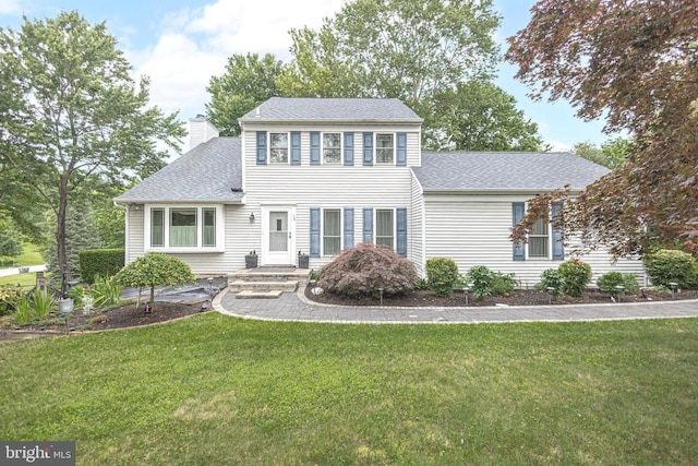 16 Kiloran Wynd Rd, Glenmoore, PA 19343 - colonial house with a chimney, a shingled roof, and a front lawn