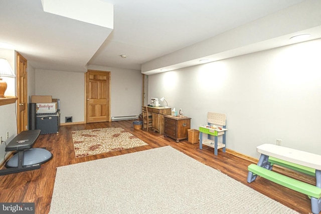 16 Kiloran Wynd Rd, Glenmoore, PA 19343 - recreation room featuring a baseboard heating unit and wood finished floors
