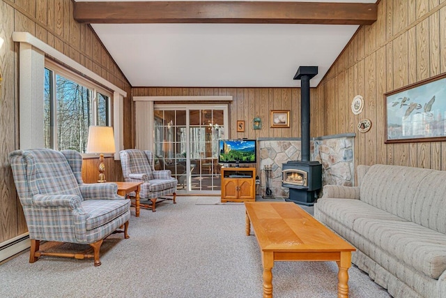 144 Beech Ln, Pocono Lake, PA 18347 - living area featuring carpet, wood walls, a baseboard radiator, and a wood stove