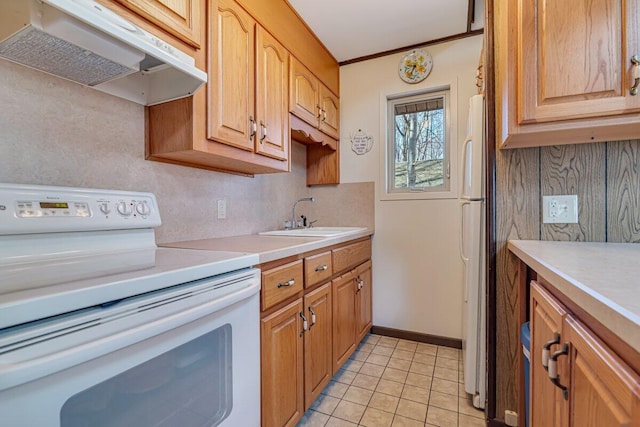 144 Beech Ln, Pocono Lake, PA 18347 - kitchen with white appliances, under cabinet range hood, light countertops, backsplash, and light tile patterned flooring