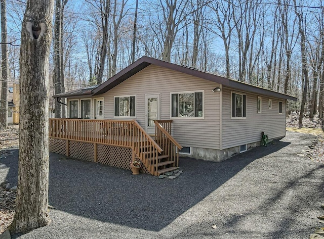 144 Beech Ln, Pocono Lake, PA 18347 - view of front facade with a deck