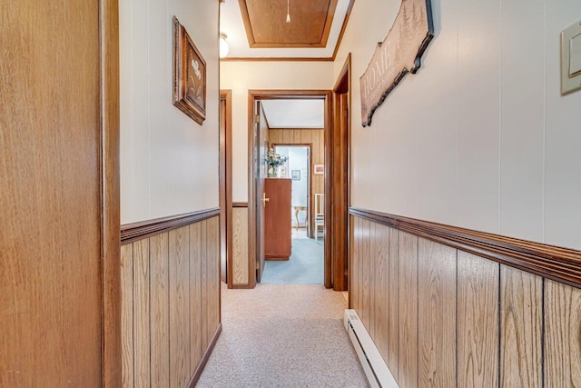 144 Beech Ln, Pocono Lake, PA 18347 - hallway with carpet floors, a baseboard radiator, wooden walls, and wainscoting