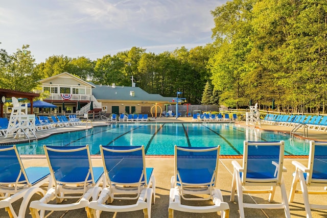 19 Conservancy Ct, Gouldsboro, PA 18424 - community pool with fence, view of wooded area, and a patio