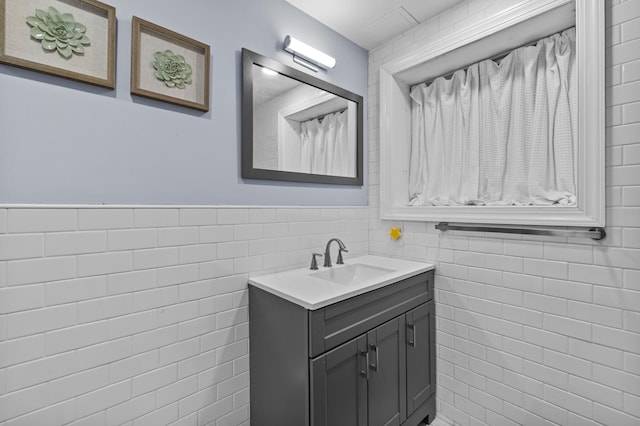 19 Conservancy Ct, Gouldsboro, PA 18424 - bathroom featuring tile walls, vanity, and wainscoting