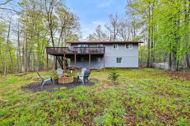 19 Conservancy Ct, Gouldsboro, PA 18424 - back of property with a fire pit, a deck, and stairs