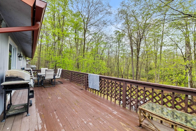 19 Conservancy Ct, Gouldsboro, PA 18424 - deck with outdoor dining space, area for grilling, and a forest view