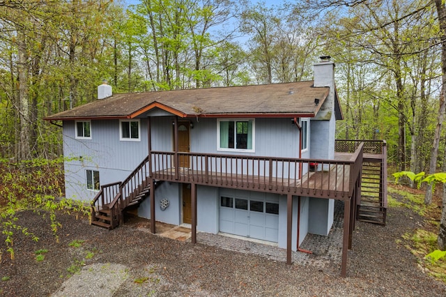 19 Conservancy Ct, Gouldsboro, PA 18424 - rear view of house with stairs, a chimney, a garage, and roof with shingles
