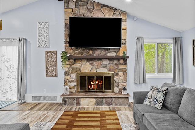 19 Conservancy Ct, Gouldsboro, PA 18424 - living room featuring vaulted ceiling, wood finished floors, and a fireplace