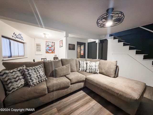 living area with stairs and wood finished floors