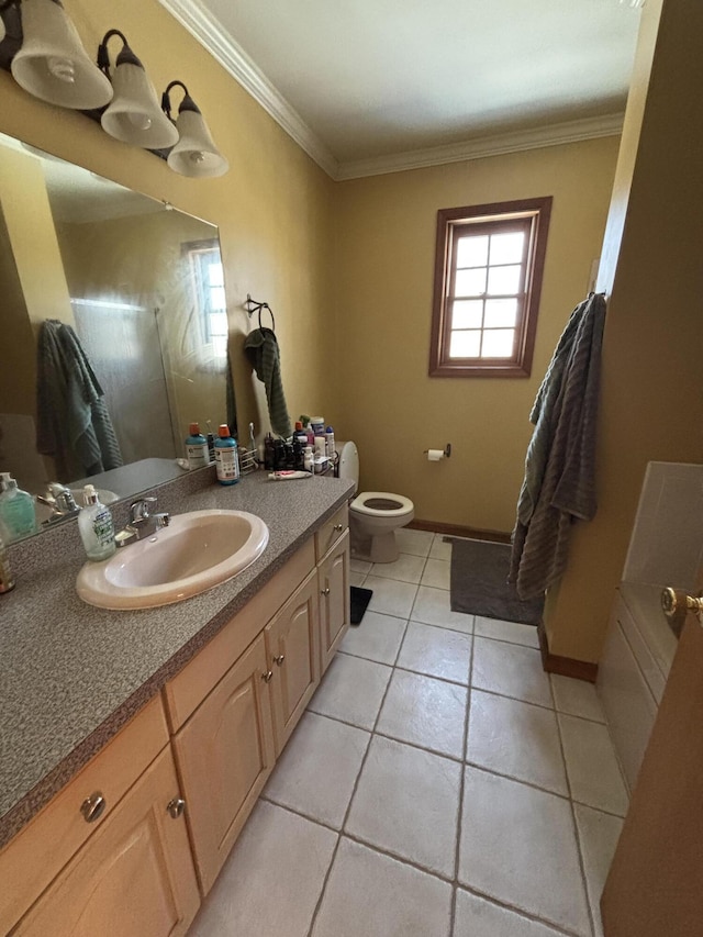 full bathroom featuring toilet, ornamental molding, tile patterned flooring, baseboards, and vanity