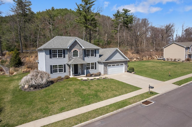 621 E Princeton Ave, Palmerton, PA 18071 - view of front facade with an attached garage, concrete driveway, a front lawn, a shingled roof, and a forest view