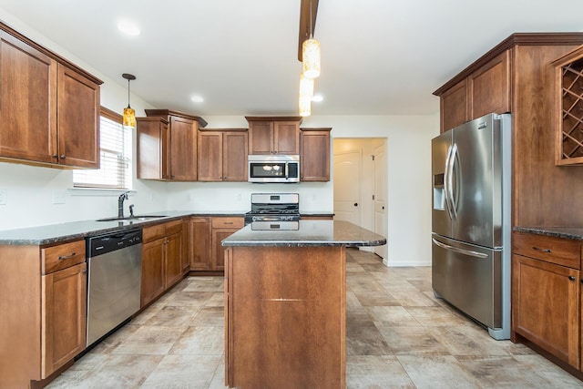 621 E Princeton Ave, Palmerton, PA 18071 - kitchen with appliances with stainless steel finishes, a sink, a kitchen island, dark stone counters, and pendant lighting