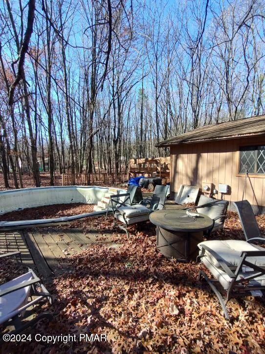 view of yard featuring a patio and a pool