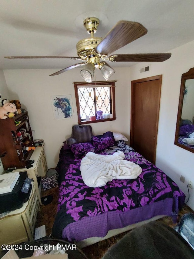 bedroom featuring visible vents and ceiling fan