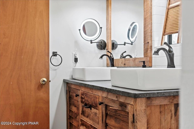 bathroom with double vanity and a sink