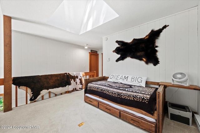 bedroom featuring vaulted ceiling and carpet flooring