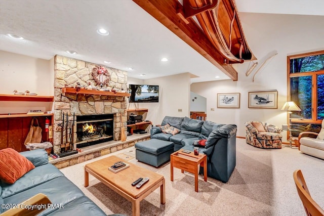 living area with recessed lighting, carpet, and a stone fireplace