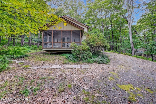 rear view of house with a sunroom