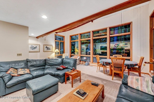 carpeted living area with beam ceiling and recessed lighting