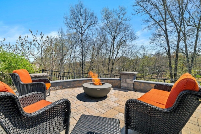 view of patio featuring a fire pit
