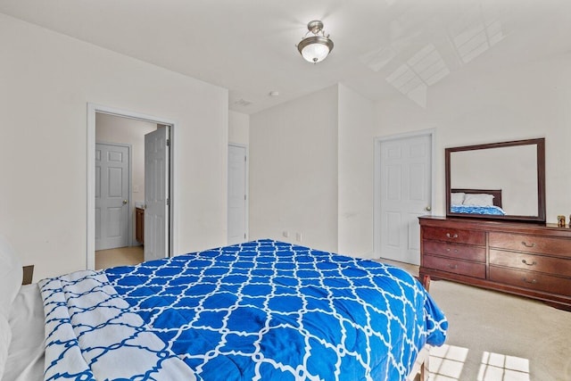 carpeted bedroom featuring lofted ceiling