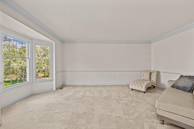 unfurnished room with crown molding, baseboards, and carpet