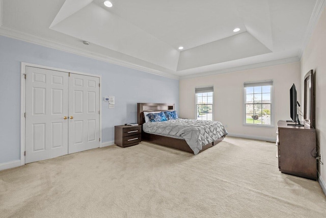 carpeted bedroom featuring crown molding, a raised ceiling, baseboards, and recessed lighting