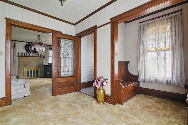 639 Iron St, Lehighton, PA 18235 - entrance foyer with crown molding, carpet flooring, a textured ceiling, and a fireplace