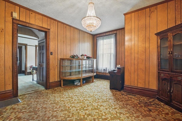 639 Iron St, Lehighton, PA 18235 - carpeted office featuring a chandelier, wood walls, ornamental molding, and a textured ceiling