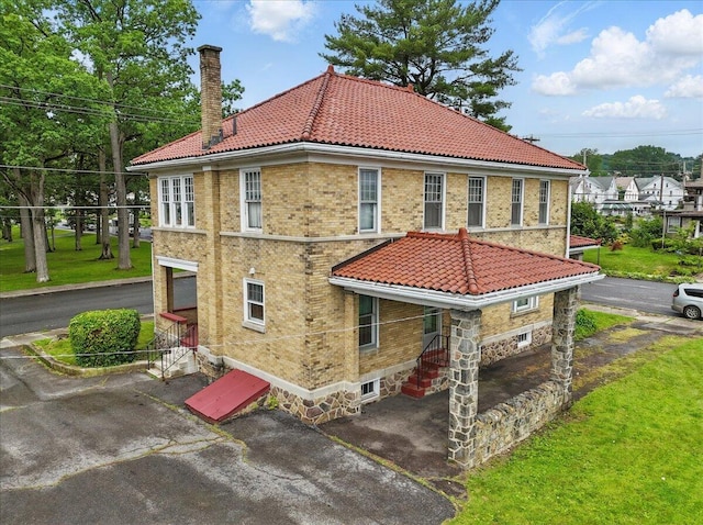 639 Iron St, Lehighton, PA 18235 - view of side of home with a tiled roof and a chimney