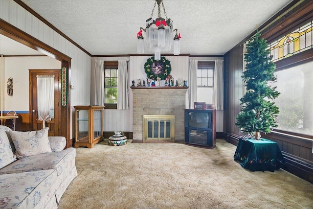 639 Iron St, Lehighton, PA 18235 - living room with ornamental molding, plenty of natural light, carpet floors, wooden walls, and a textured ceiling