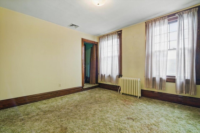 639 Iron St, Lehighton, PA 18235 - empty room featuring radiator heating unit and carpet floors