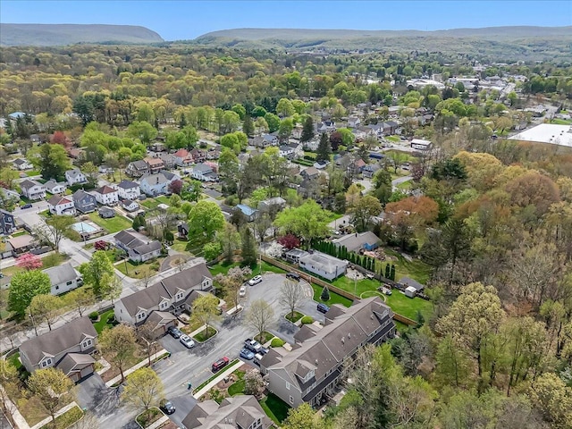 aerial view featuring a view of trees and a residential view